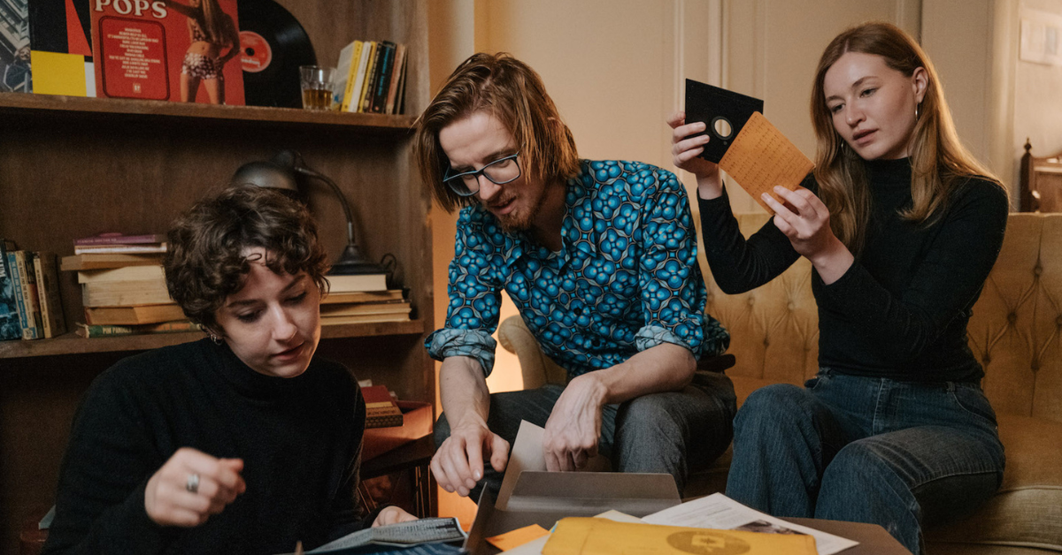 Three friends investigating a Home Mystery on a sofa